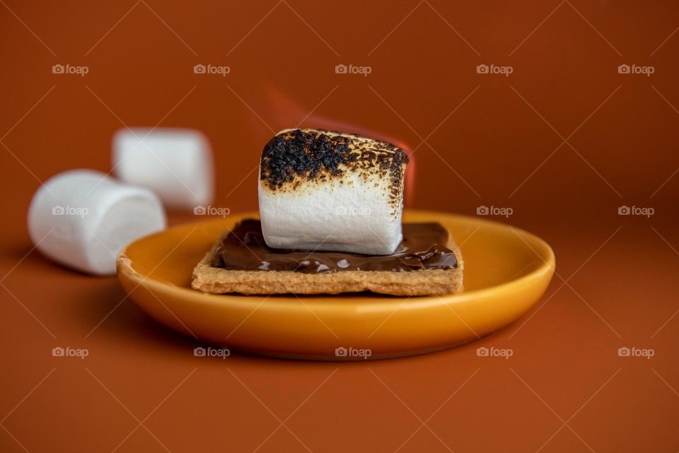 S’more with a toasted, flaming marshmallow 