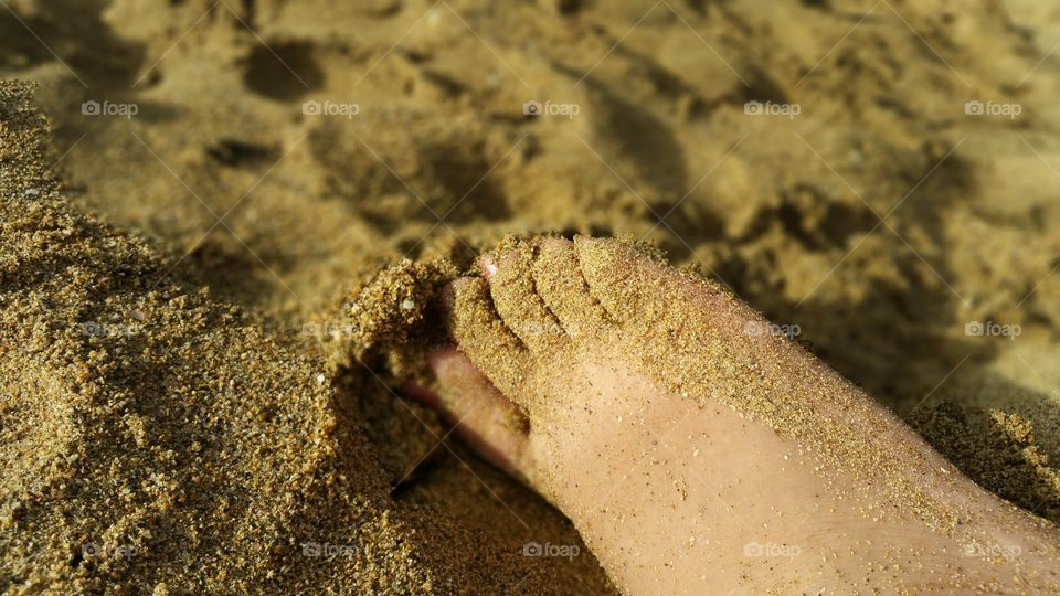 Foot and sand