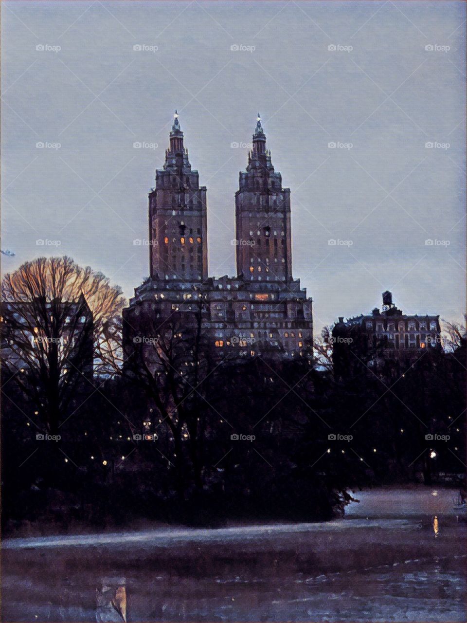 Evening, frozen, The Lake, Central Park with the San Remo Luxury Skyscraper background New York City. 