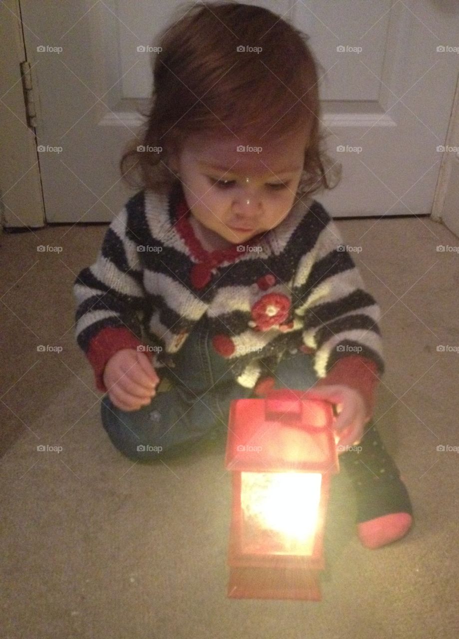 Toddler with Christmas lantern