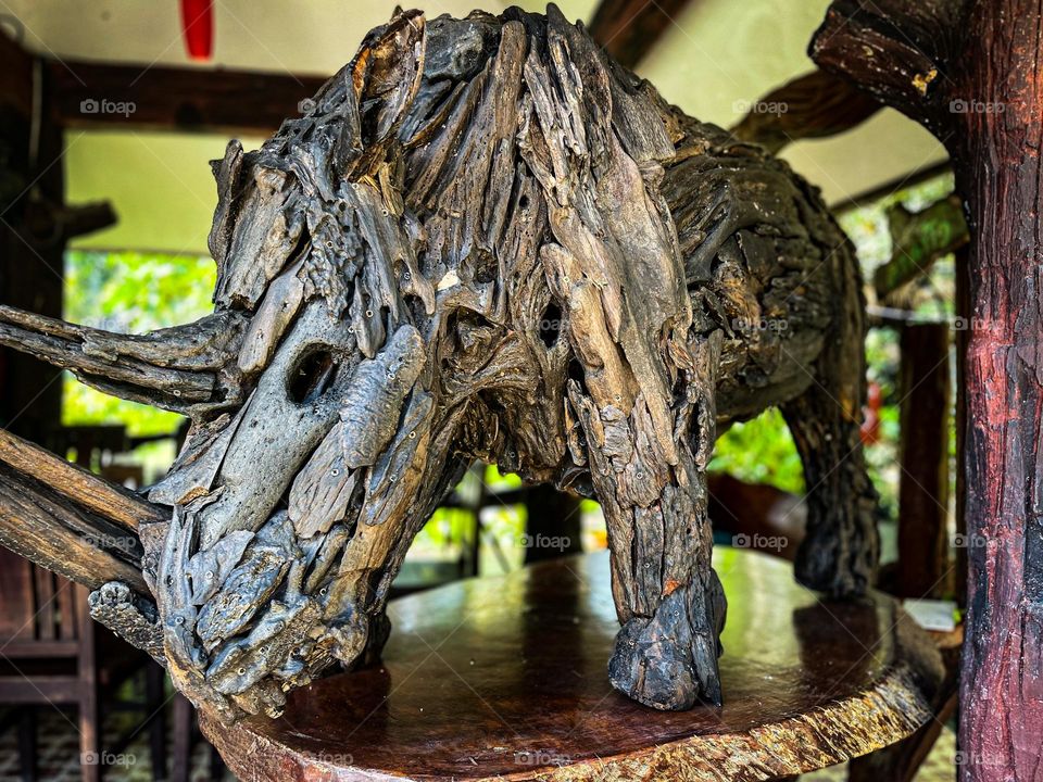 Wood craft of a rhinoceros decoration with blurry background 