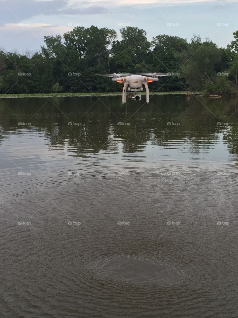 Drone. Drone hovering over the river 