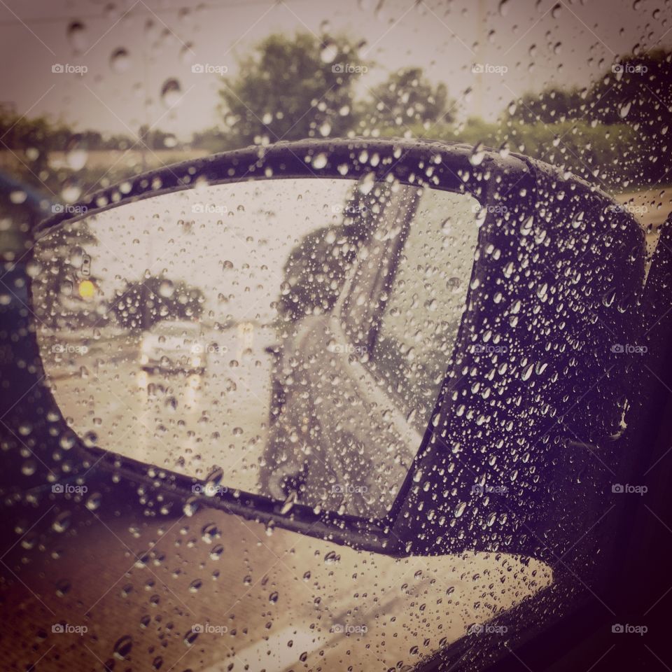 Rain in the rear view mirror 
