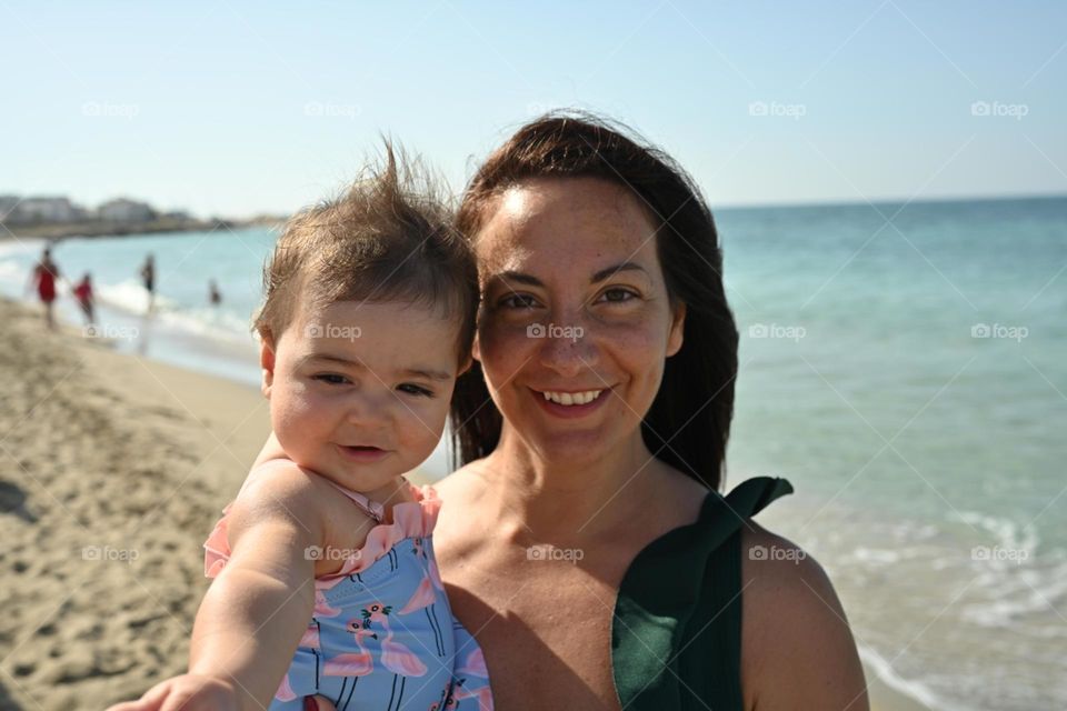 mom and daughter on the beach