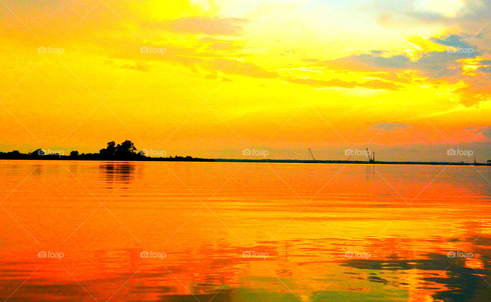 Sunset over Jolly Bay. This magnificent sunset was taken over Jolly Bay!Silky waters and a reflection multicolored clouds in the sky are superb