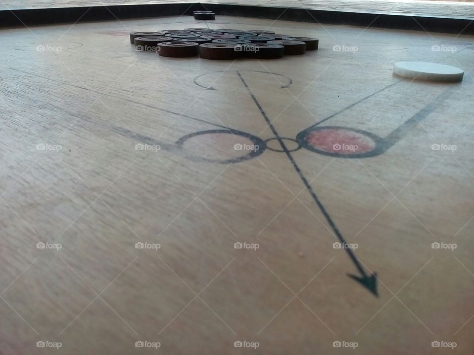 carom board indoor playing instrument