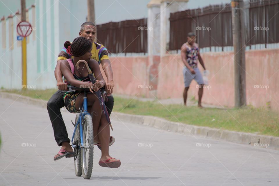 People In Cuba.Couple On Bike