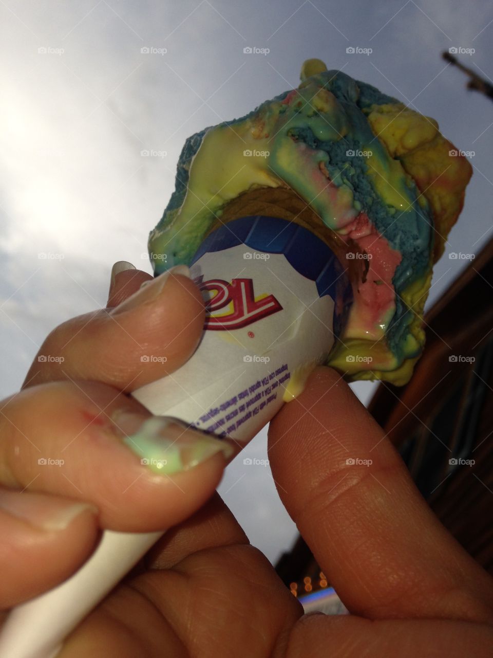 Ice cream in hand. Superman ice cream cone, on a summer night outside!