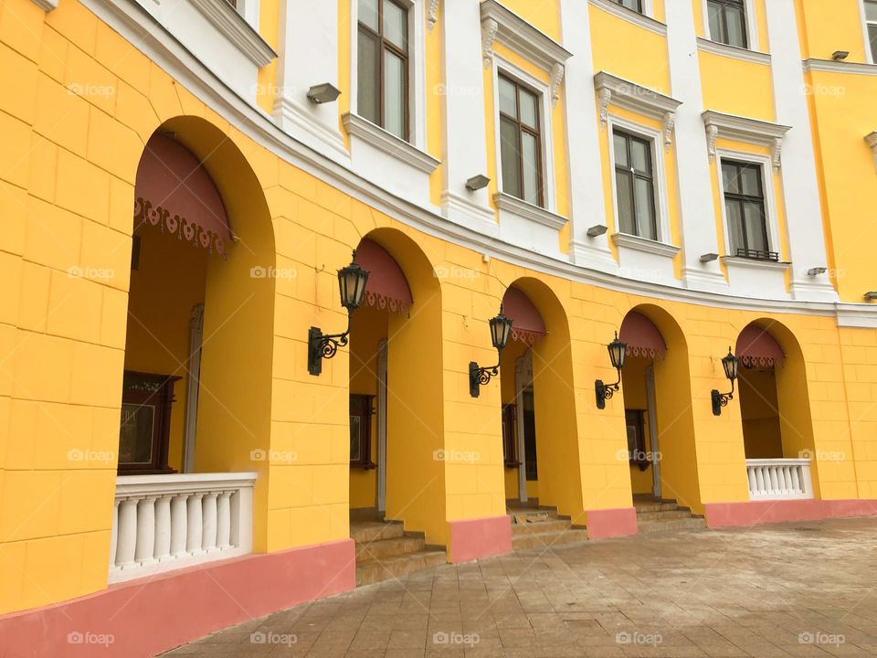 Arches and lanterns of the yellow building 