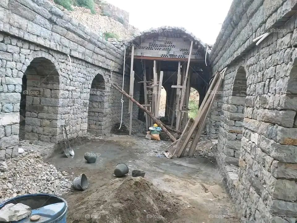 A stunning view of green mountains covered in fog in Yemen