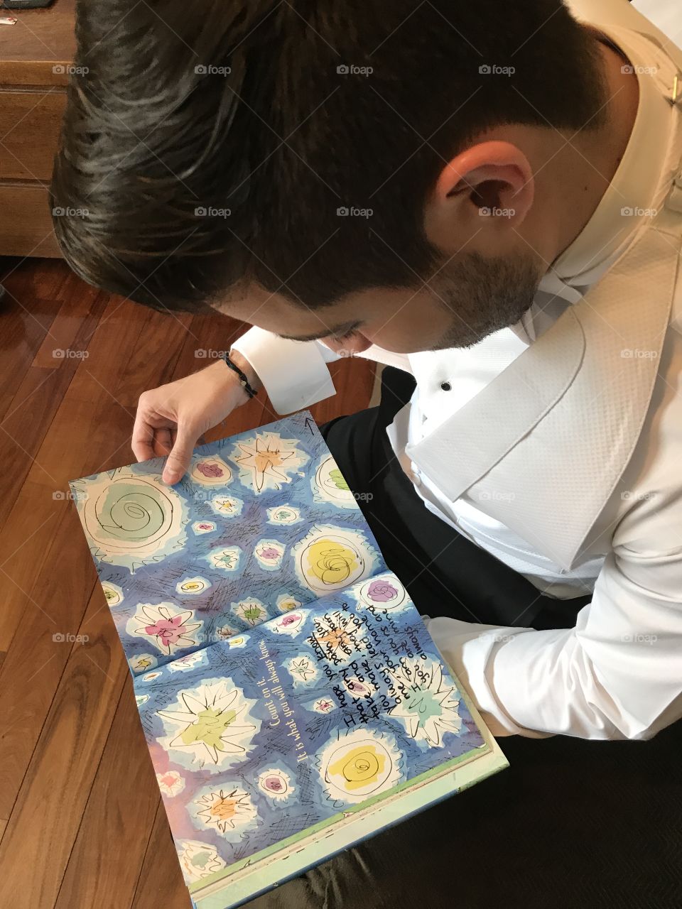 Young man reading book