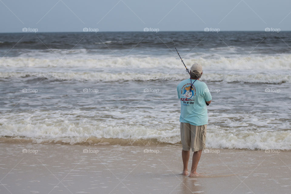 Man fishing in the beach