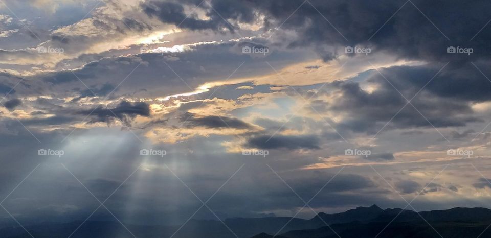 The heavenly skies opening up.Clouds.