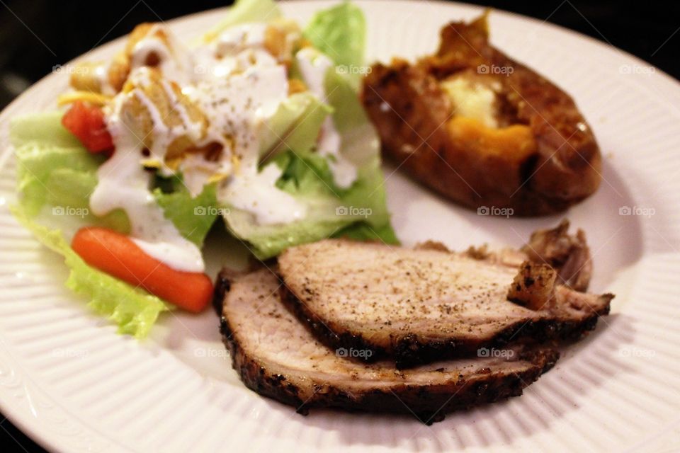 Pork loin with sweet potato and salad