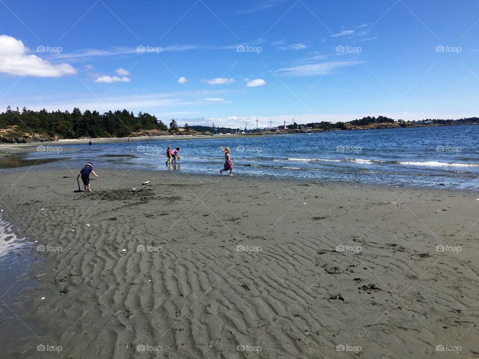 Kids play on the beach