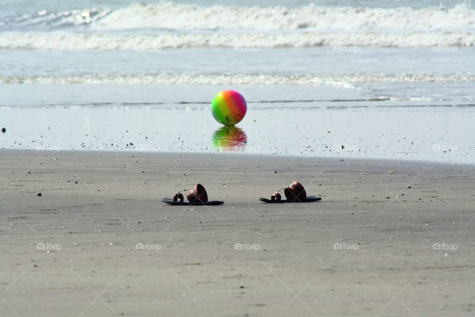 ready for beach ball. slippers are out ,ball is ready for play. Location Dapoli, India. Jan 2020