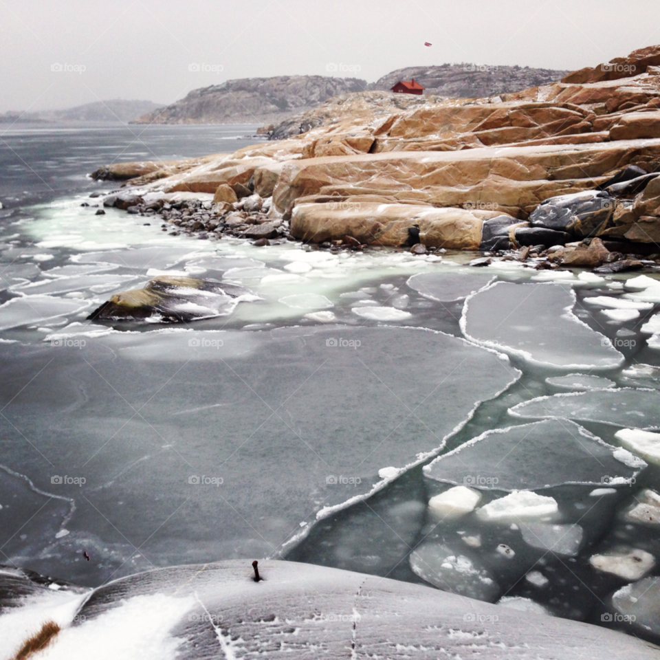 winter ice sea rocks by haq