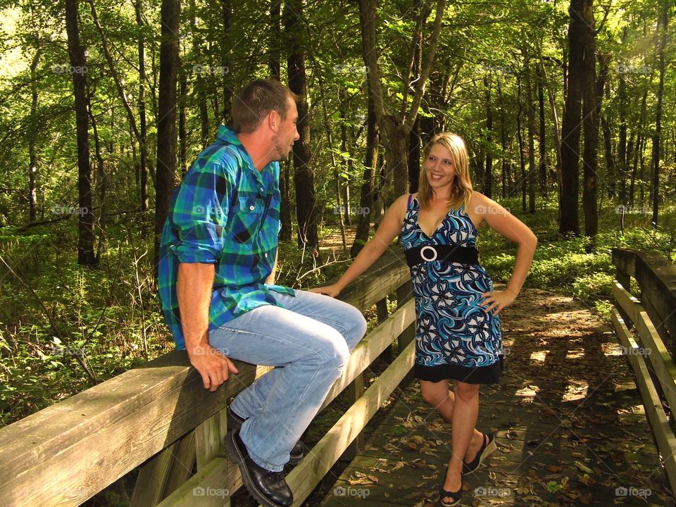Woman Seduces Man on Bridge With Smile