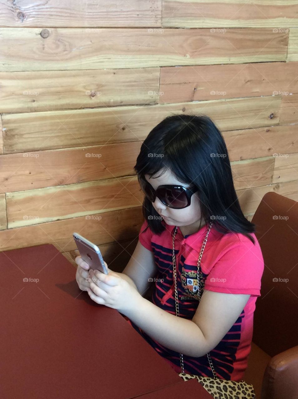 kid using technology in the cafe