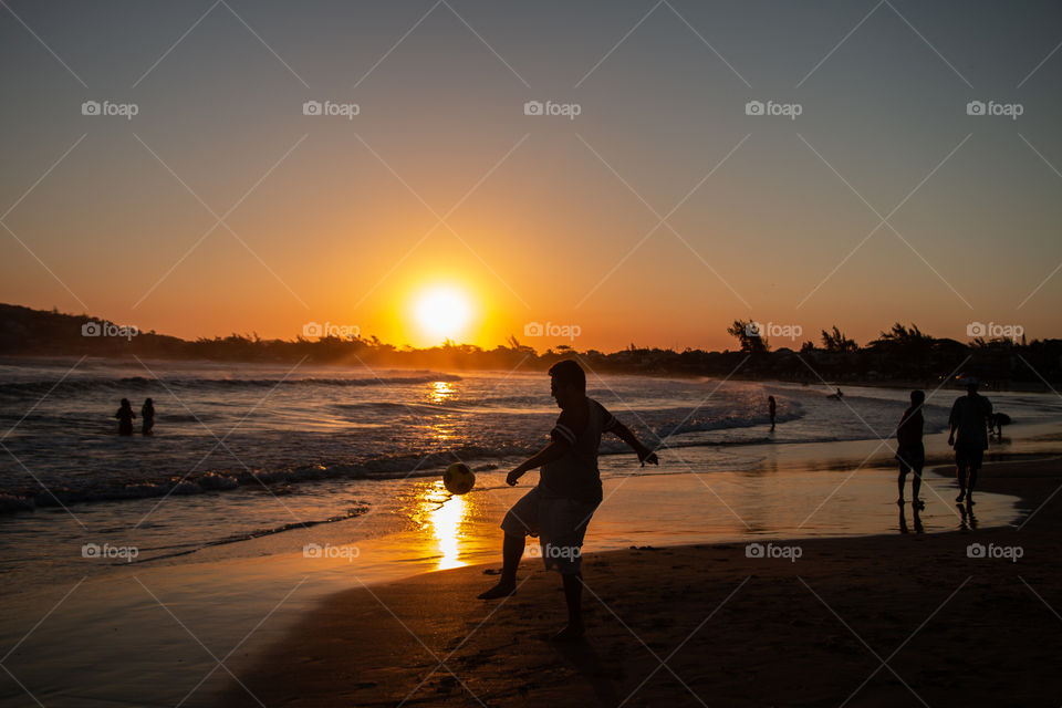 This is one of the ways cariocas like to end a day at the beach with friends and family. This is my brother in law playing soccer at sunset in Rio de Janeiro.