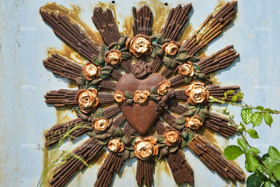 A heart surrounded by rays, art work