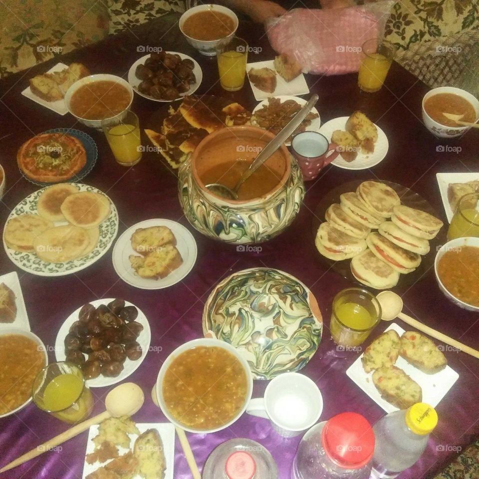 Moroccan table full of various kind of food.