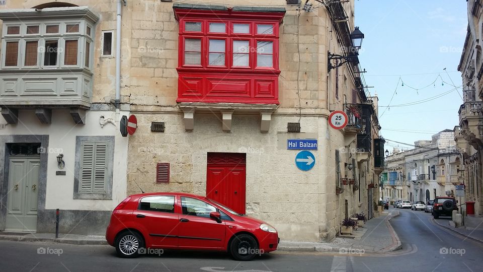 Predominantly red street corner Malta