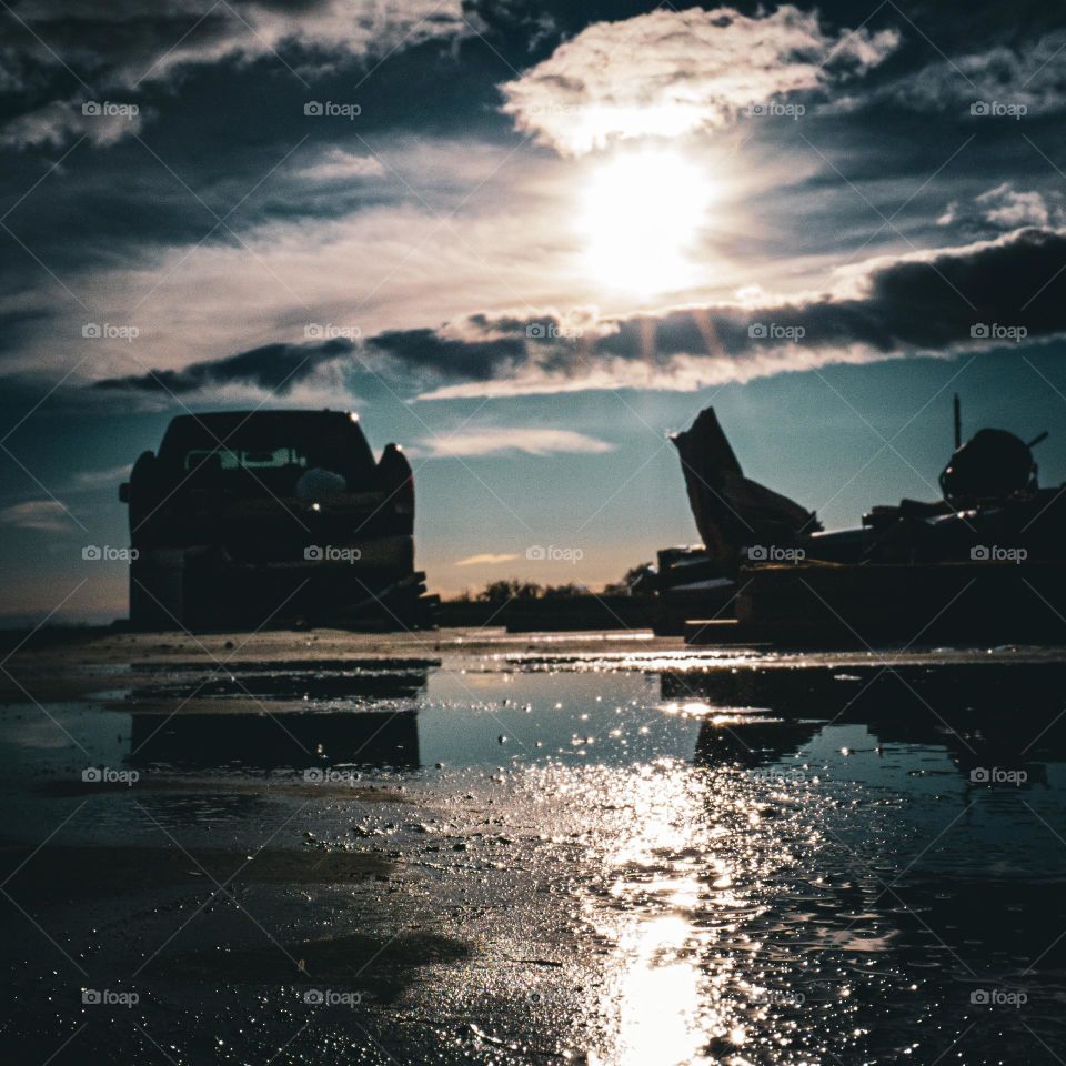 Reflecting off of the concrete.