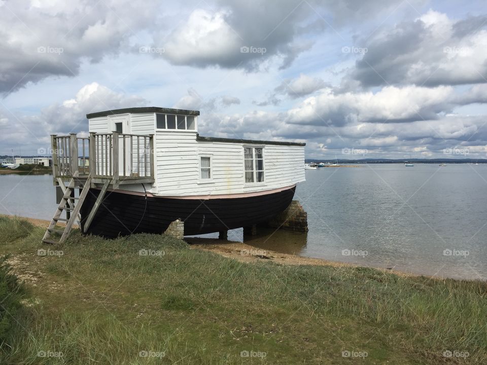 Houseboat by still water 