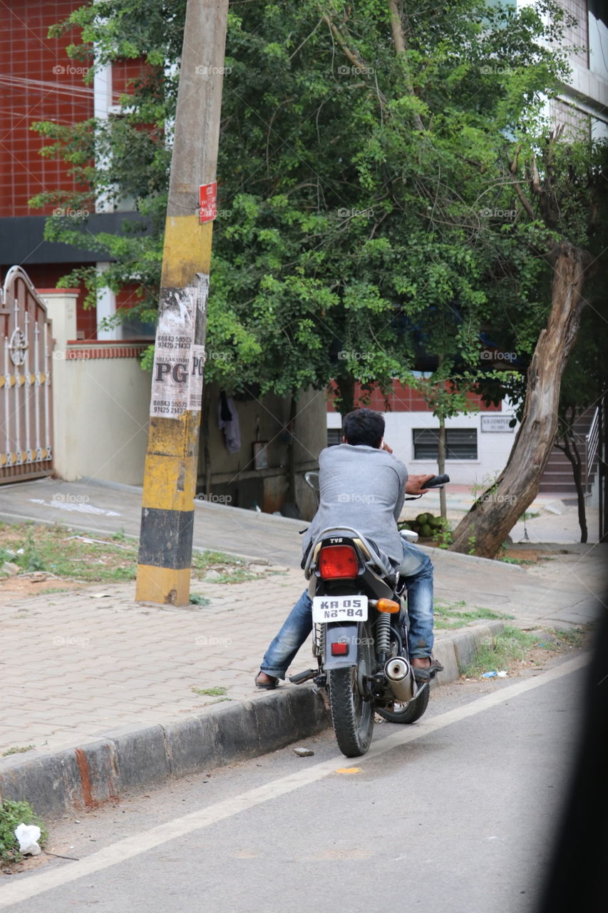biker busy on mobile