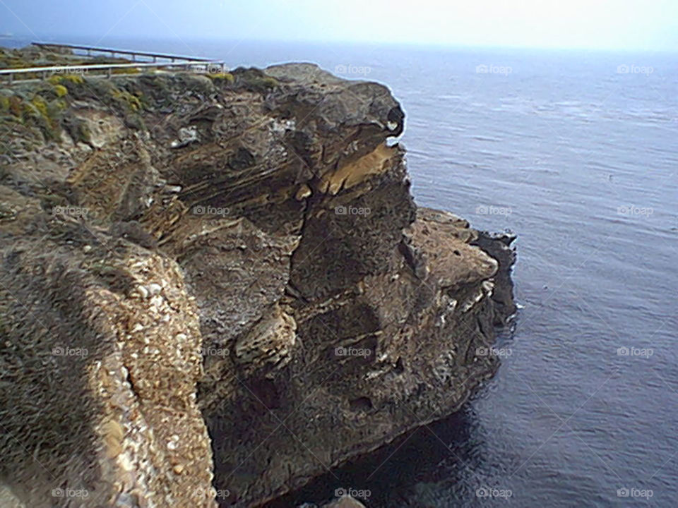 Steep Cliff overlooking water 