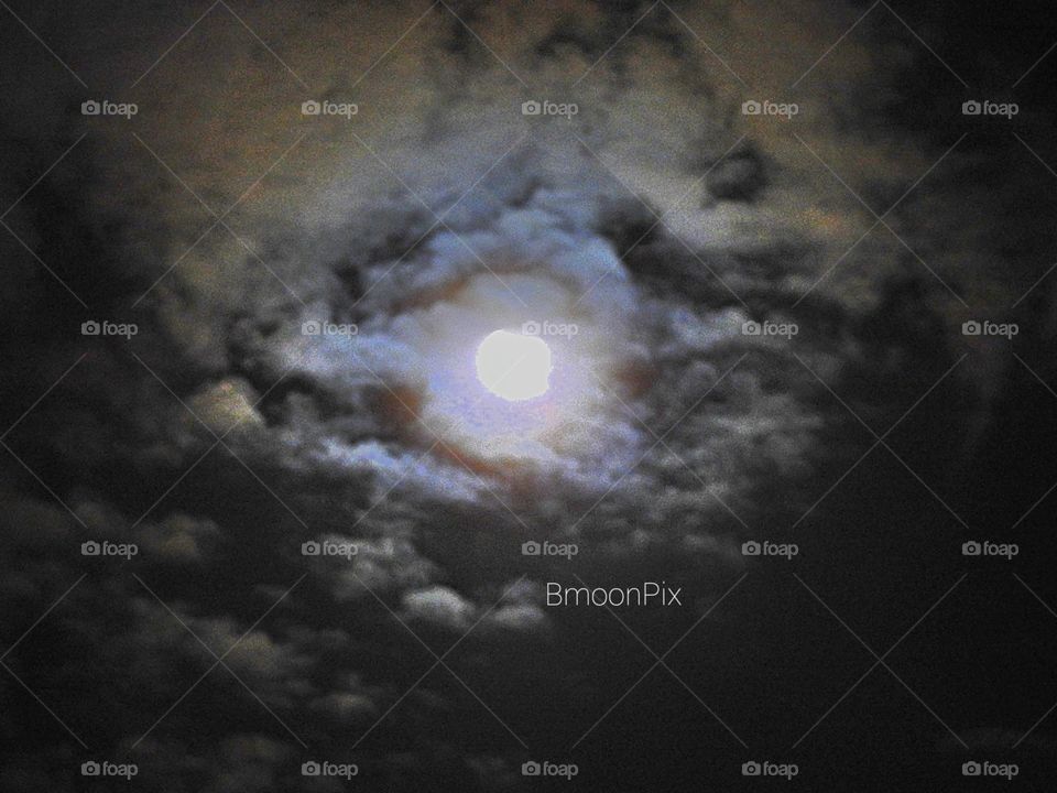 full moon eclipse in the clouds