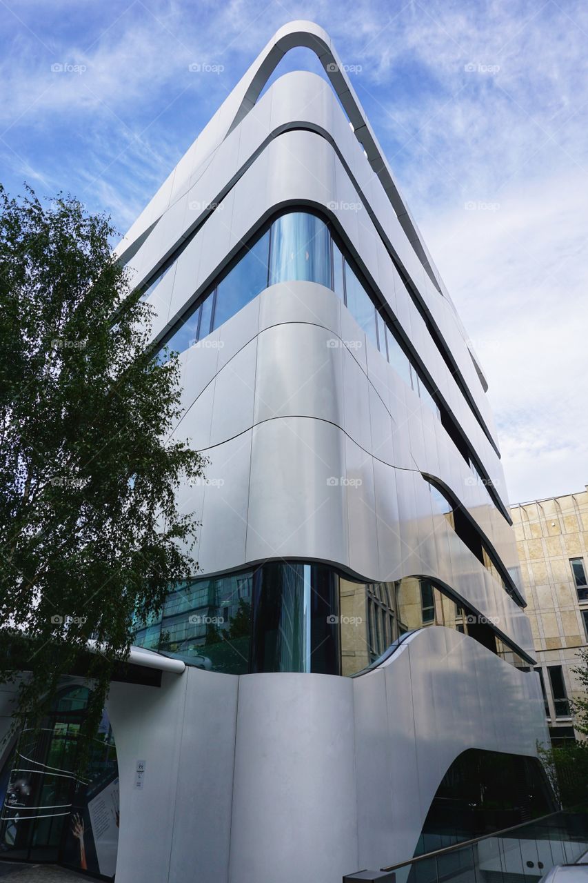 Unusual boat shaped building ... reminds me of the example photo ... not sure if this qualifies as exact symmetry ... will await to see if accepted or not π