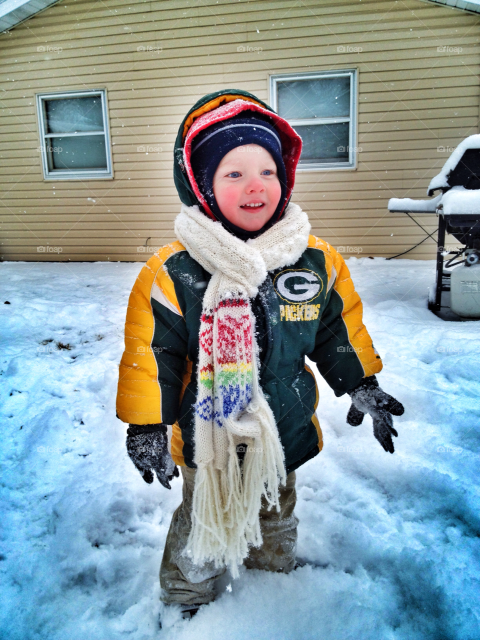 All bundled up. Playing in the snow 
