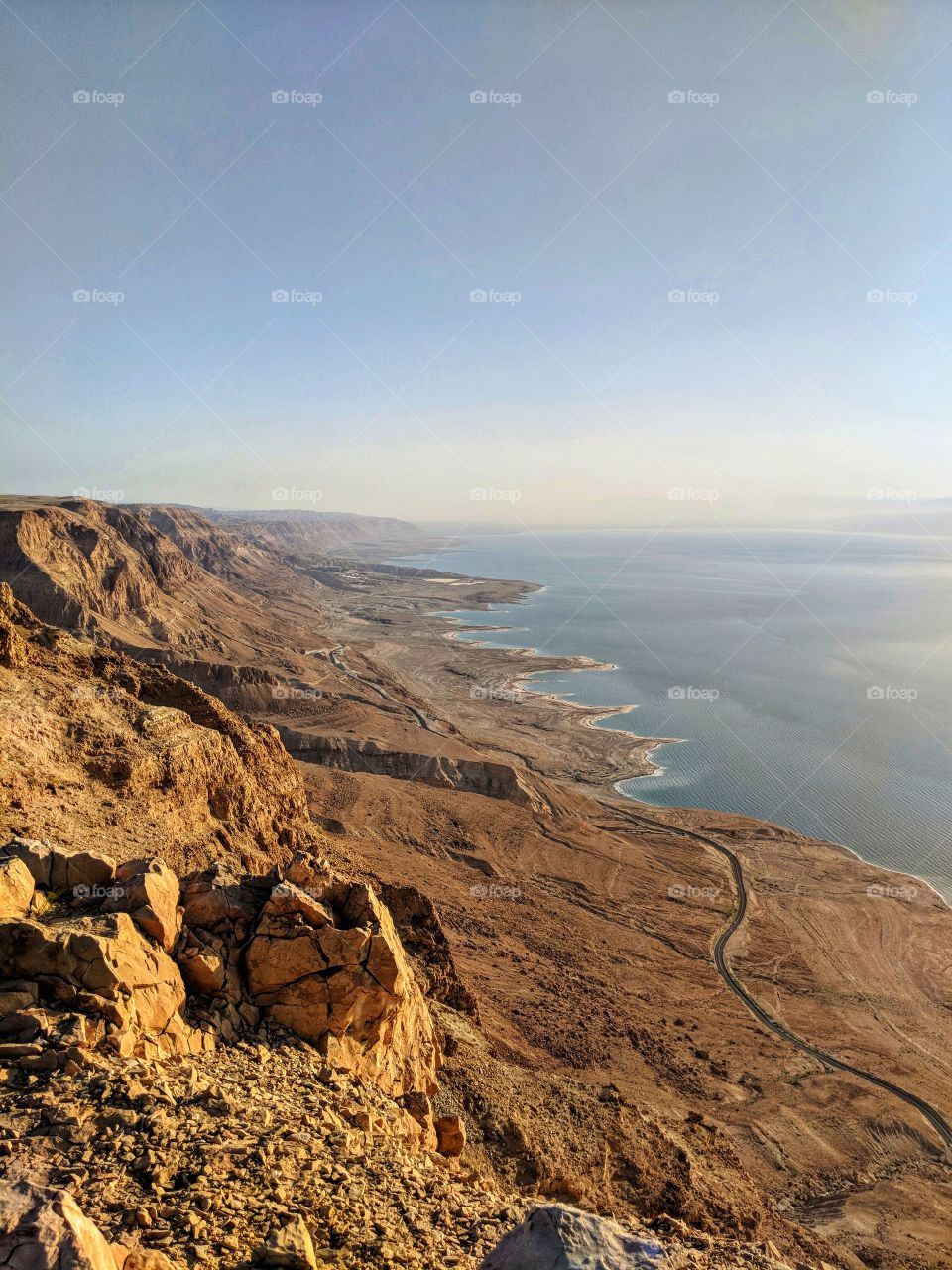 Morning light on the cliff of the Judaean desert above the Dead Sea and Road 90
