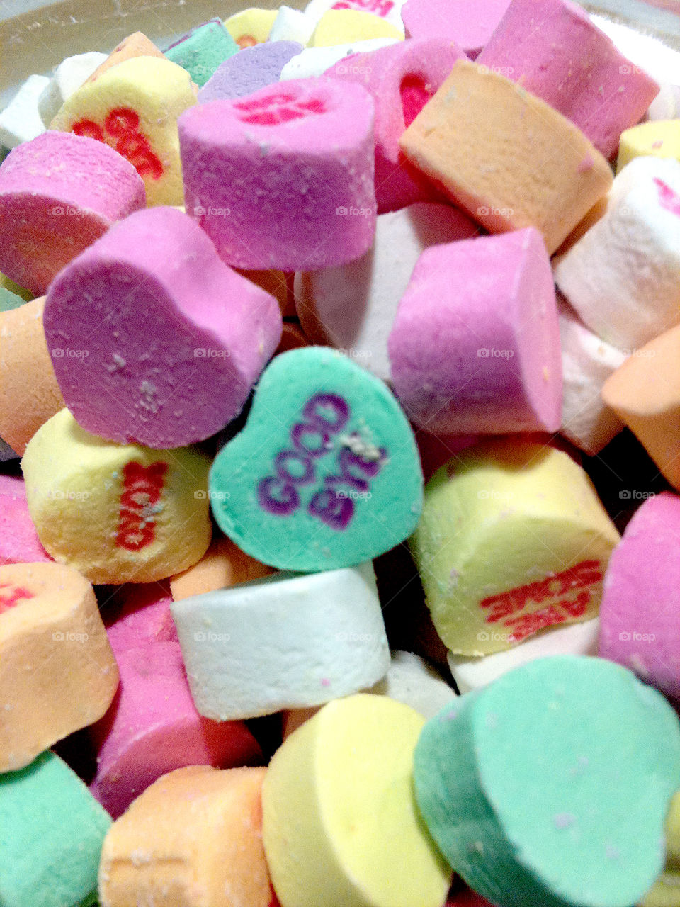 Goodbye. Good Bye conversation candy heart in dish.