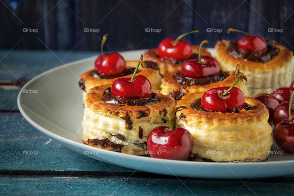 Vol-au-vents filled with dark chocolate and cherries