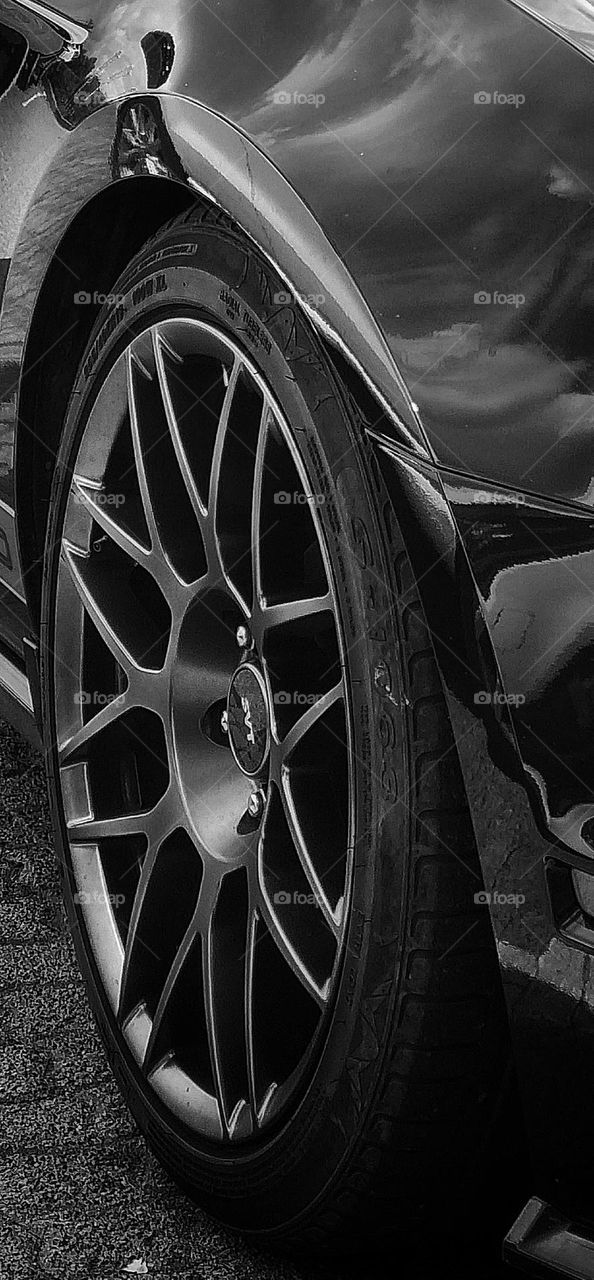 the front Tyre of a sports car. circular