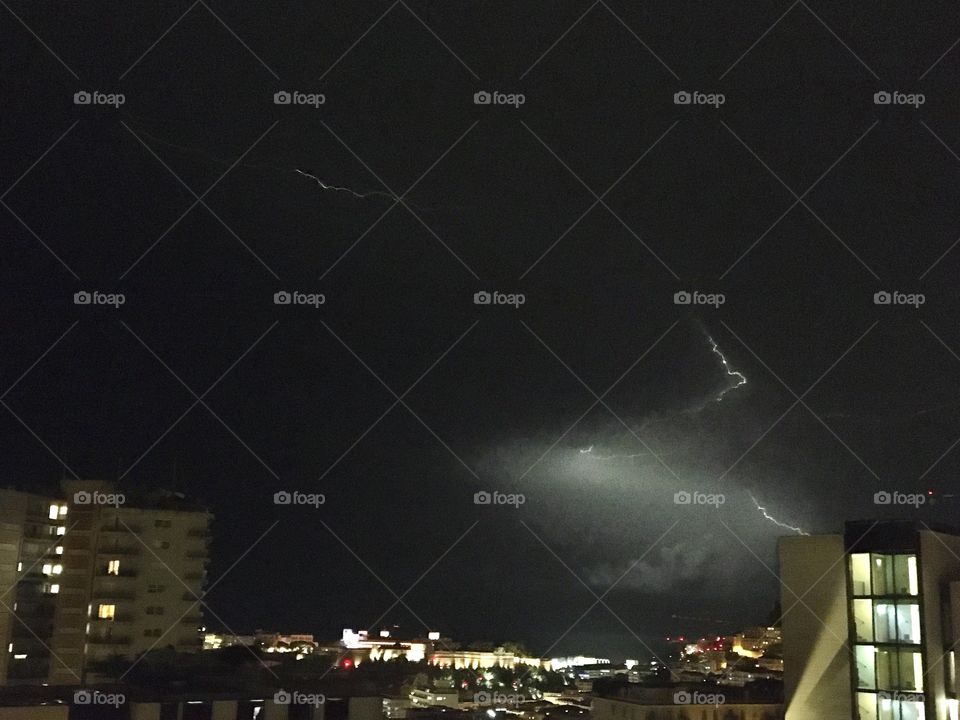 Lightnings in cloudy and rainy sky at night