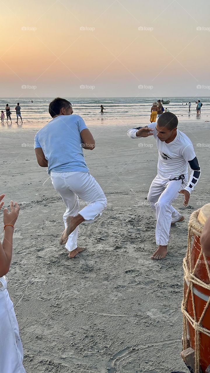 Men playing capoeira 