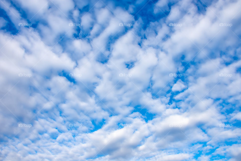 The beauty of the sky with clouds and the sun.