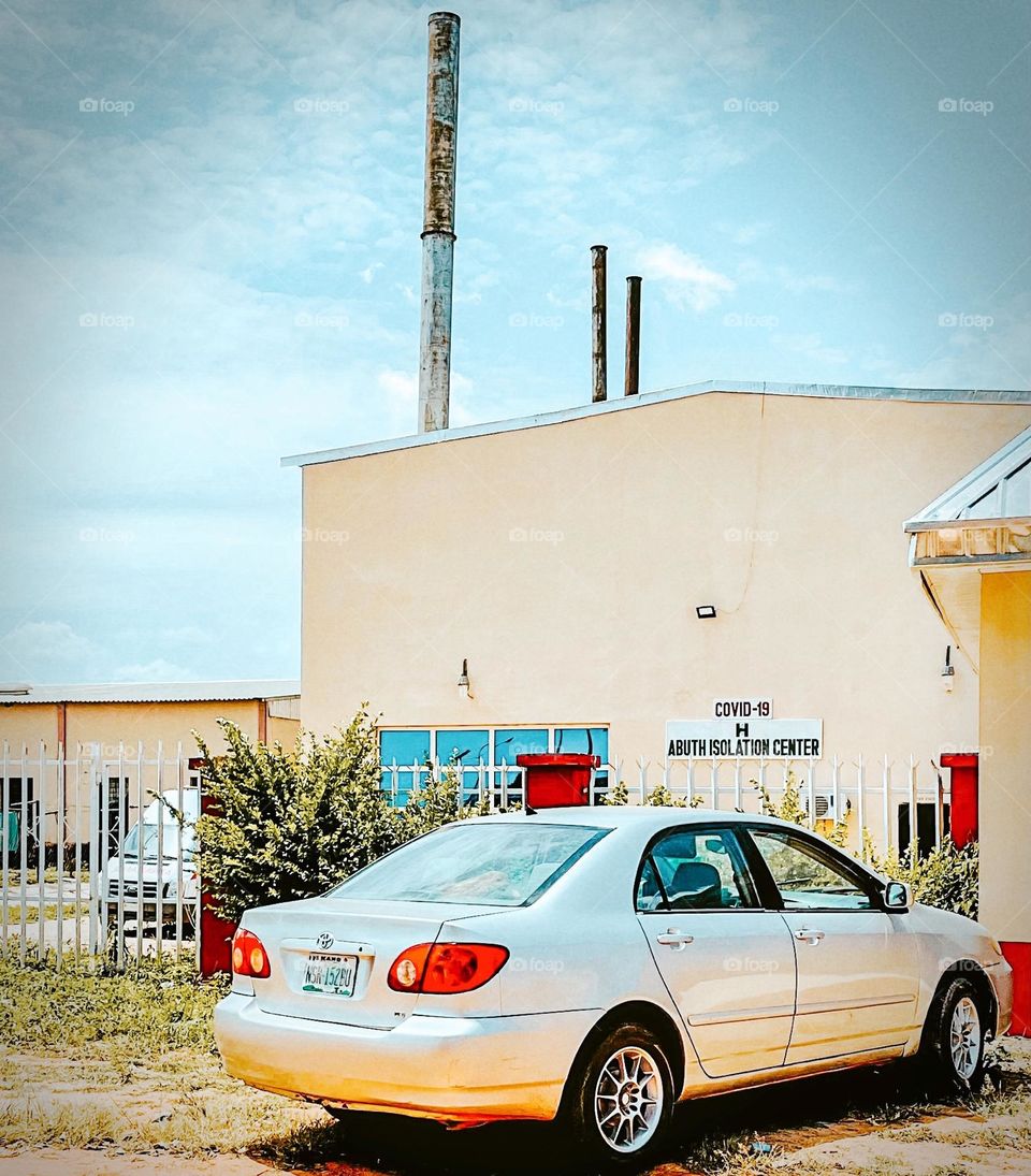 A Toyota parked in front of ABUTH