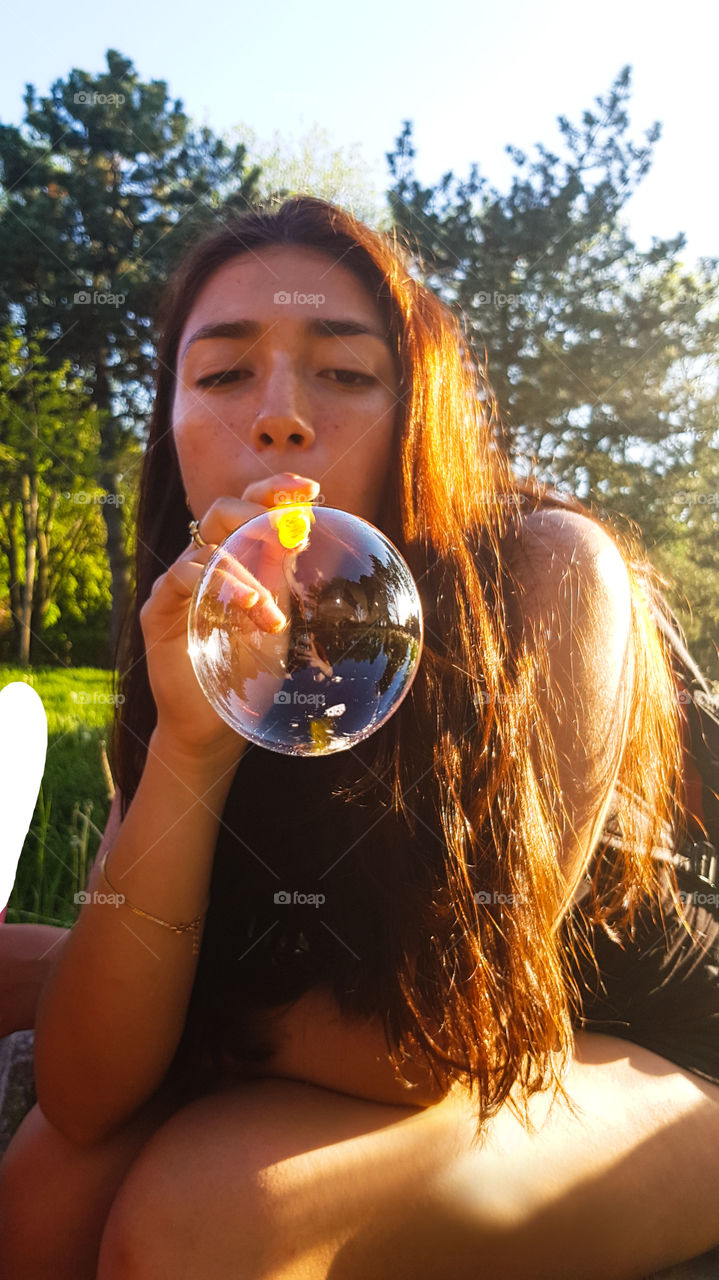 Summer fun, blowing soapy bubbles