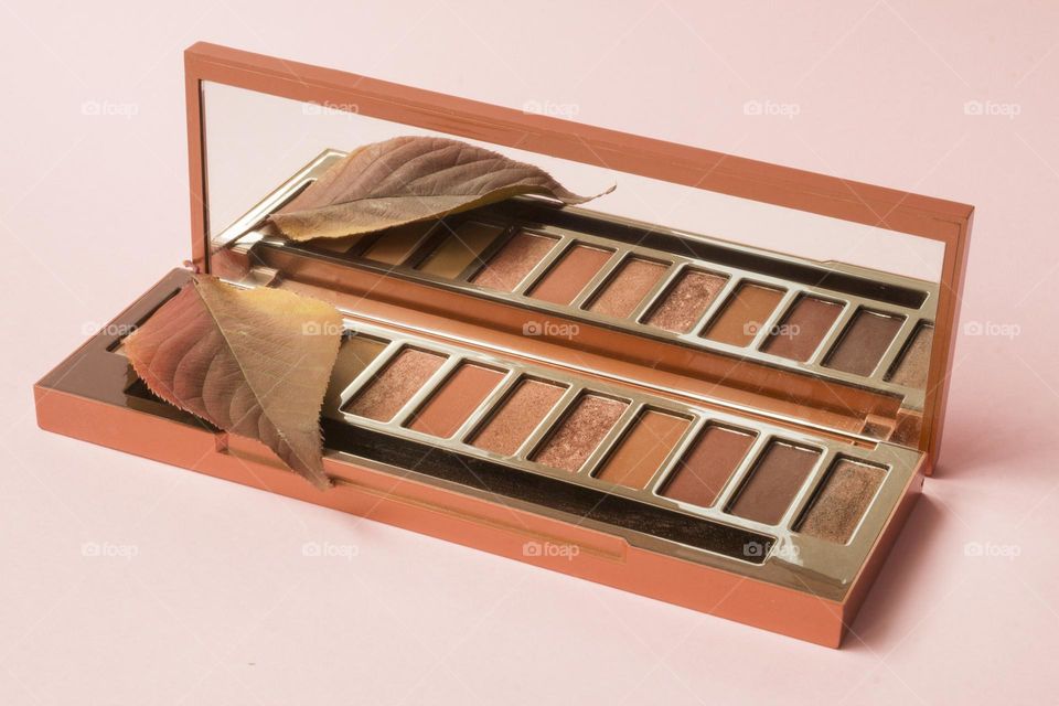 Colourful autumn leaf and eye shadow with fall colour