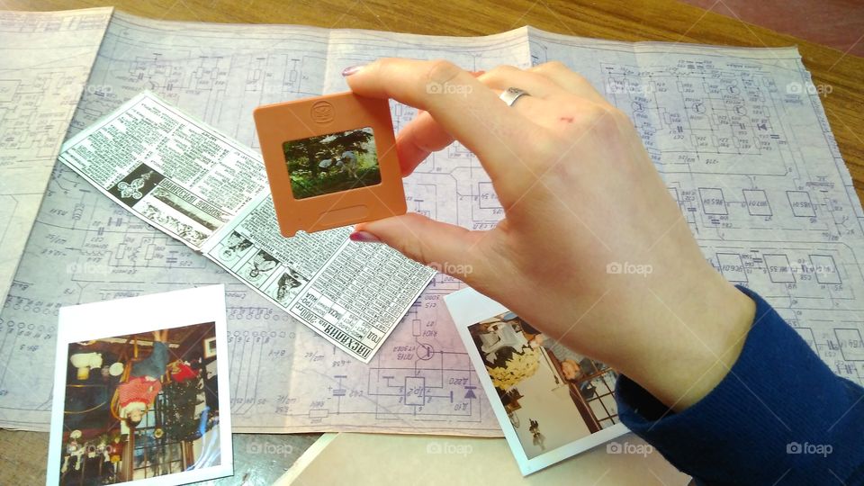 old photo in hands, map, filmstrip