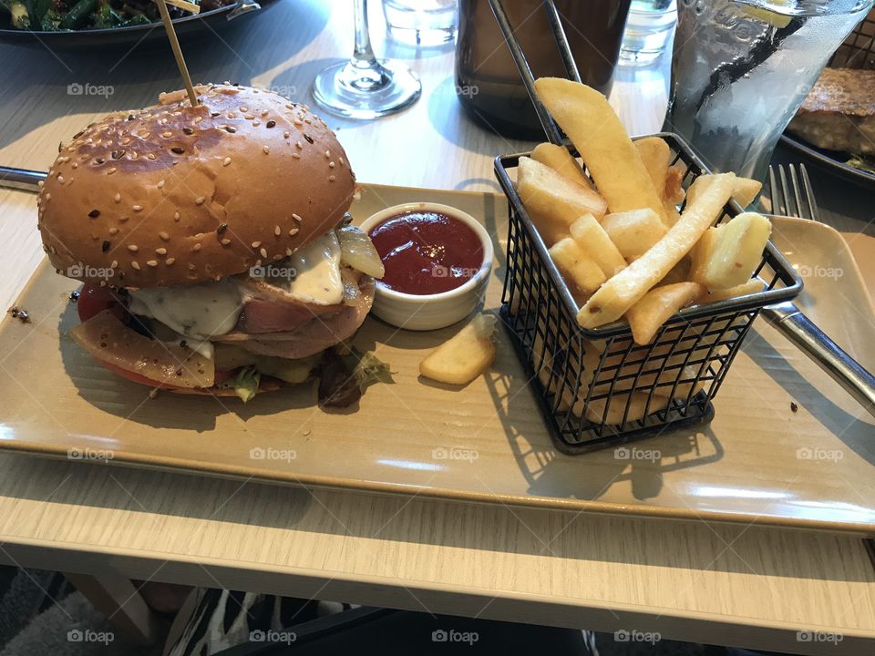 50 acres Beef burger: bacon, cheese tomato lettuce pickles onion mustard aioli served with chips at Cheltenham RSL Melbourne Australia 