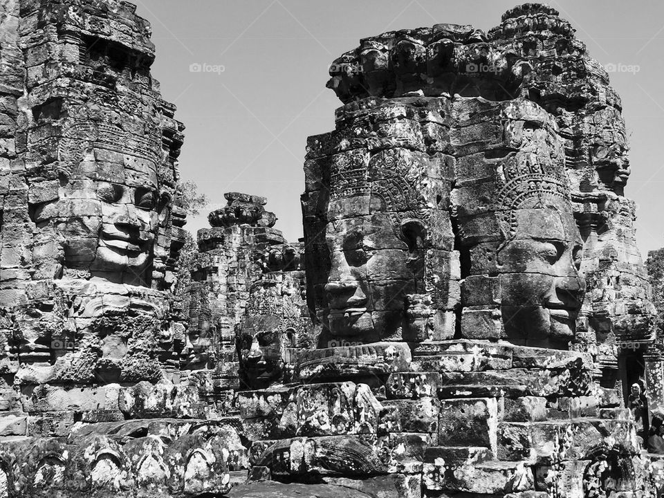 Bayon Temple, Cambodia. This temple is renowned for its hundreds of stone faces sticking into the sky like jagged peaks.