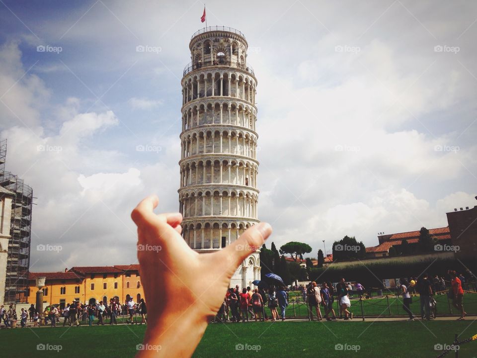 Pisa tower in a hand 