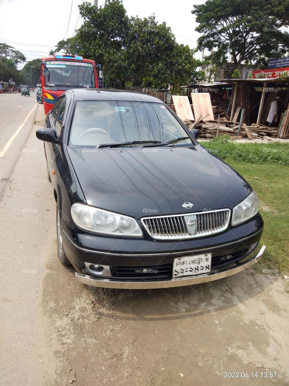 Nissan sunny black car on the street