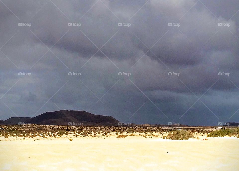 Stormy Sky in Corralego on Fuerteventura's northern coast in the corner of the island which is renowned for its dazzling natural beauty flanked by sand dunes and mountains. 
